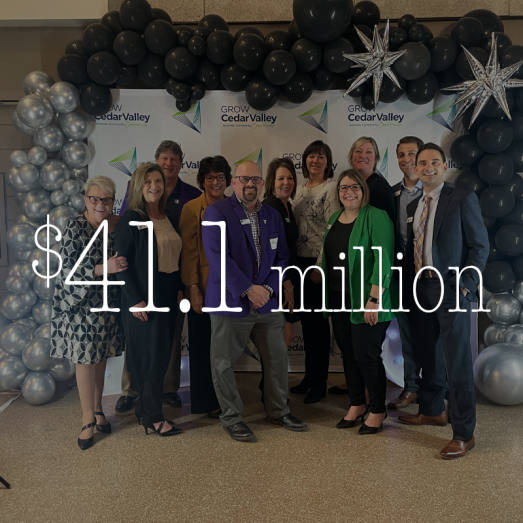 2024 CRA Investments $41.1million. Group photo of CBT employees posing for a photo at an event.