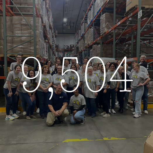 2024 employee community volunteer hours 9,504. Image CBT volunteers smiling at camera indoors.